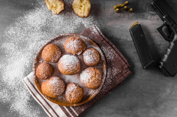 Homemade donuts with sugar and gun