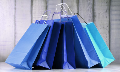 Composition with blue paper shopping bags