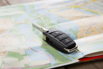 Car rental concept - car key on the map