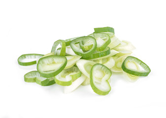 Chopped spring onions on a white background