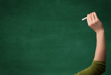 Hand writing on clean blackboard