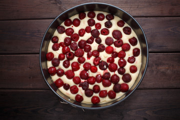 Homemade cherry pie on rustic background