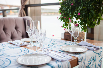 Cafe Table with Flowers in summer day