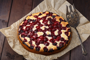 Homemade cherry pie on rustic background
