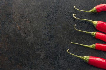 cayenne chilli peppers on rusty metal background