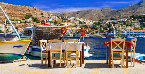 Traditional Greece - small street fish tavernas in Symi island, Dodecanesse