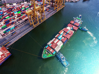 container ship in import export and business logistic.By crane ,Trade Port , Shipping.cargo to...