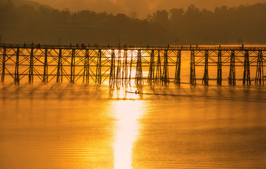 Morning light Mon Bridge in Kanchanaburi. silhouette.
