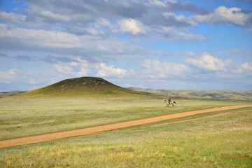 Lonely horseman in Kazakhstan steppe