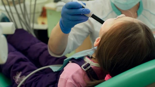 Drying Inlays with UV Curing Light in Dental Procedure