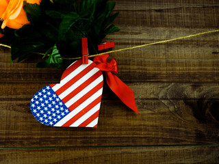 Obraz premium Flag of United States of America on heart shape with old vintage paper background, with clipping path - Independence Day