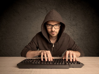 Computer geek typing on keyboard