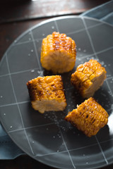 Large pieces of fried corn on ceramic plate