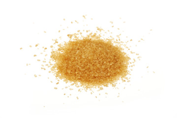Pinch of brown cane sugar spilled on white