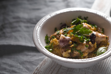Pilaf with rice, chicken, garlic and parsley