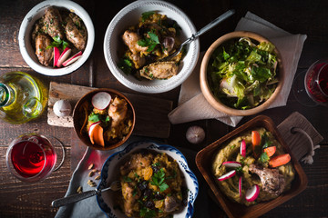 Pilaf, Salad in bowls on the holiday table top view