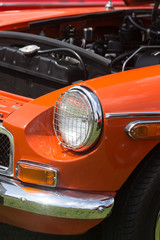 Headlight of a Orange Vintage Car
