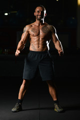 Fototapeta na wymiar Healthy Man Showing Abdominal Muscle
