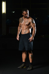 Fototapeta na wymiar Healthy Man Showing Abdominal Muscle