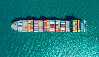 container ship in import export and business logistic.By crane ,Trade Port , Shipping.cargo to harbor.Aerial view.Top view. - obrazy, fototapety, plakaty