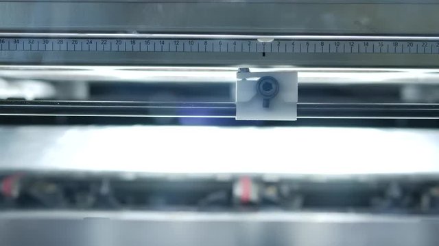 Envelopes on the assembly line in a factory with stroboscopic light