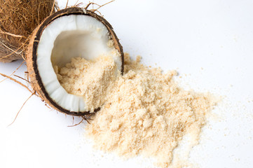 Coconut fruit and sugar on white