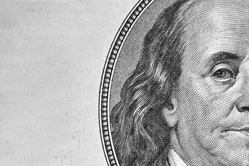 Benjamin Franklin's portrait on 100 dollar bill.