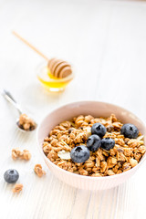 Healthy morning with granola breakfast on white kitchen table