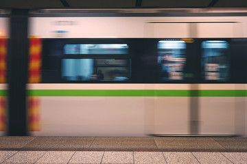 Metro train speeding up in the subway