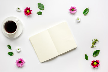 Obraz na płótnie Canvas Copybook, americano and flowers on white table top view mock-up