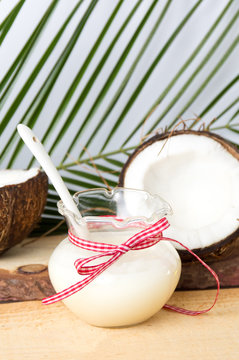 Coconut fruit and milk in a bottle