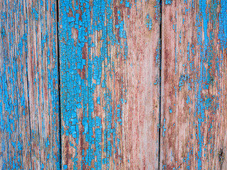 Fototapeta na wymiar old wooden surface with peeling paint