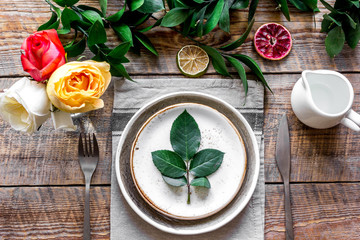 ceramic tableware top view on wooden background mock up