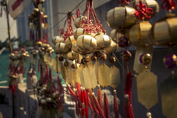 Chinese wishes amulets hanging on the wall in buddhist temple