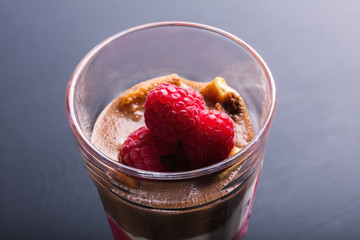 Glass of chocolate and rapsberry dessert