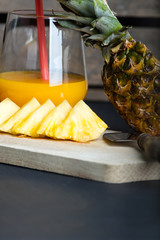 Fresh pineapple and glass with pineapple juice