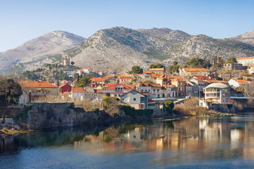 Fototapeta na wymiar View of Trebinje city and Trebisnjica river on a winter day. Bosnia and Herzegovina.