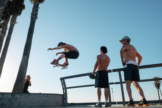 Skateboarder in mid air doing skateboard trick
