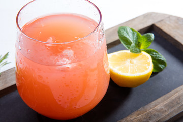 Two glasses with colourful drinks