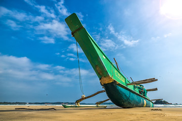 Fishing boat and fishing net on the ocean coast of Sri Lanka vintage nature background