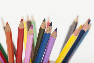 the tips of colored pencils on white background