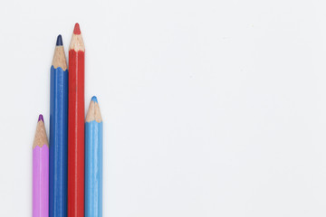 colored pencils on a white background. the concept of family with two kids