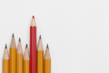 red and yellow pencils on white background