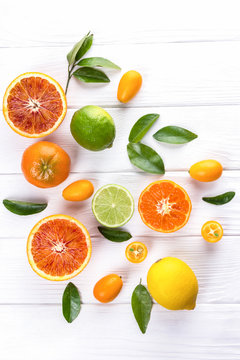 Fresh citrus fruits with leaves. Sicilian oranges, lemon, mandarin, lime, kumquat