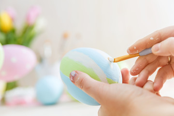 Easter eggs handicrafted with pastel stripes.