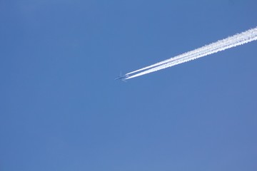 Airplane on the blue sky. 