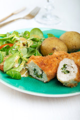 Kiev cutlet with jacket potatoes and salad