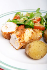 Kiev cutlet with jacket potatoes and salad