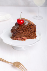 Chocolate cake with juicy cherries