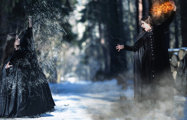 Inner demons. Fight of two witches. The two elements - fire and water. Double exposure